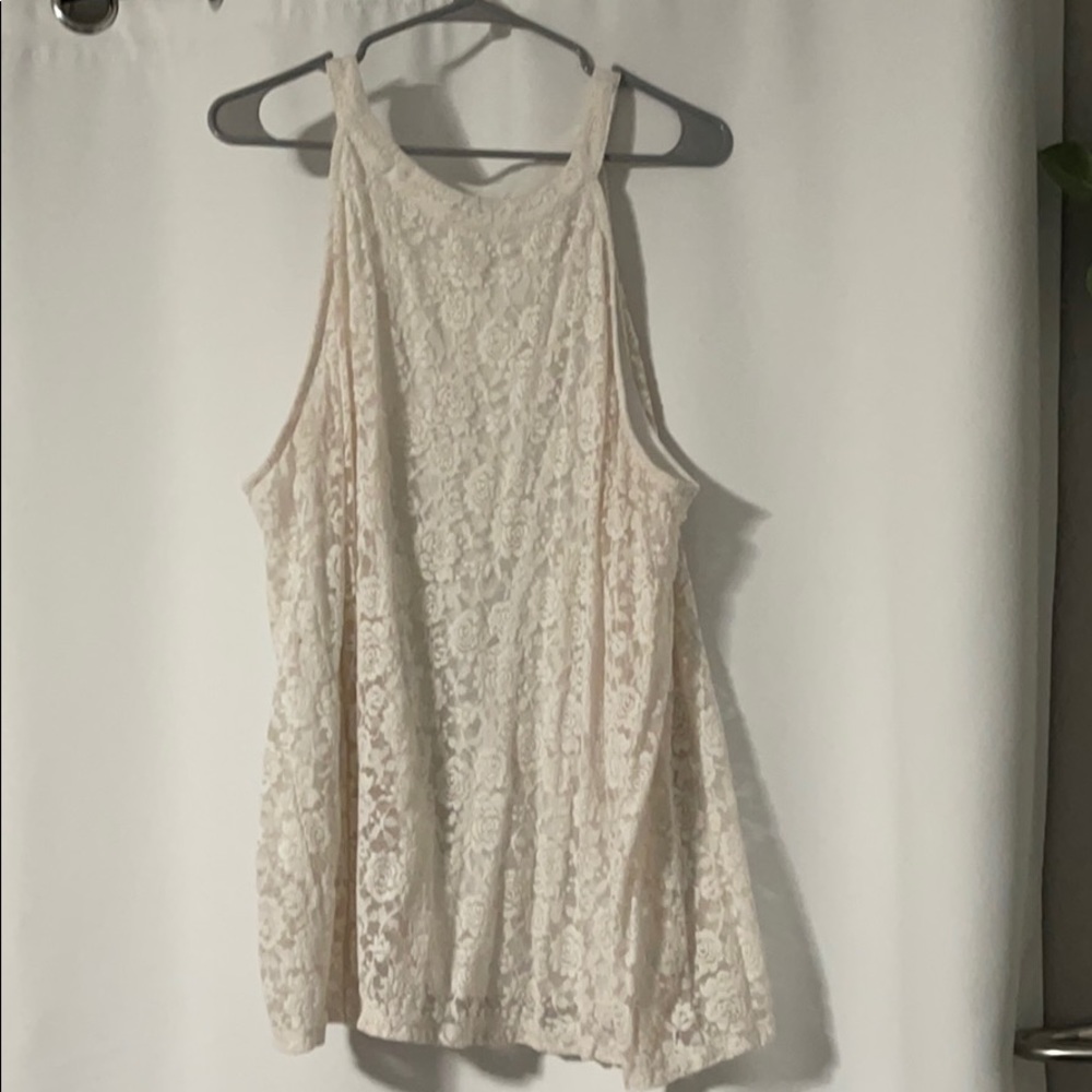 Off-white lace shirt.